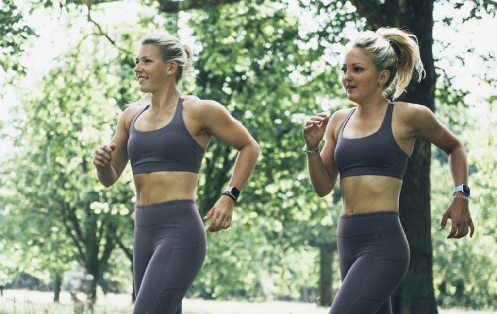 Hannah and Emily running through the park